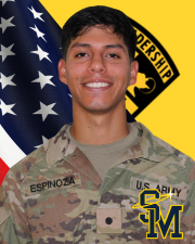 CDT Espinosa standing in front of the American flag and Cadet Command Flag