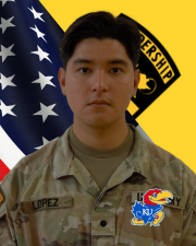 CDT Lopez standing in front of the American flag and Cadet Command Flag