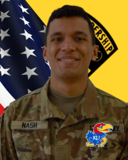 CDT Nash in OCP uniform in front of a flag
