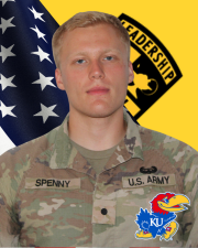 CDT Spenny standing in front of the American flag and Cadet Command Flag