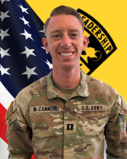 CPT McCammond in his OCP uniform in front of a flag