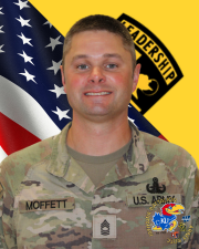 MSG Moffett in OCP uniform in front of flag and cadet command flag